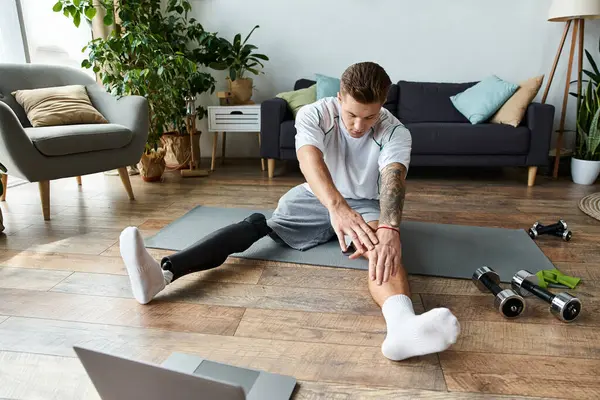 Young man practices yoga in his cozy living room, showing strength and determination. — Stock Photo