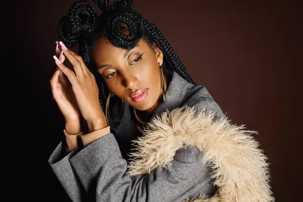 A stunning young woman showcases her unique hairstyle and fashion in an elegant setting. — Stock Photo