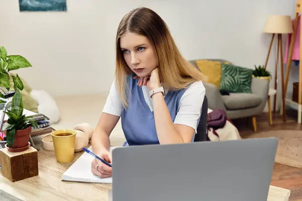 Contemplative teenager engages in study, surrounded by a cozy, inviting room atmosphere. — Stock Photo