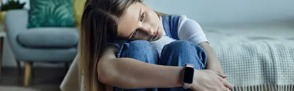 A sad teenage girl in her room, embracing her personal space and style, banner — Stock Photo