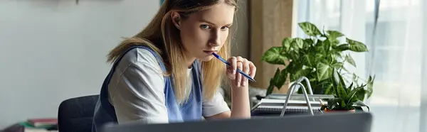 A teenage girl reflects on her studies surrounded by personal items in her stylish room, banner — Stock Photo