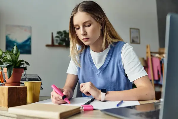 A teenage girl is focused on her studies, surrounded by modern decor and plants in her room — Stock Photo