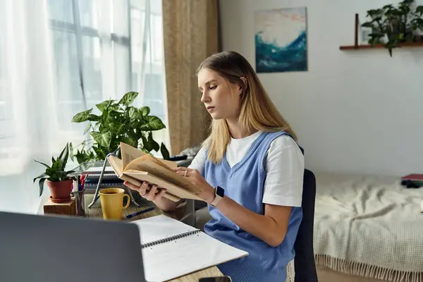 A young girl immerses herself in literature while surrounded by cozy decor and plants. — Stock Photo
