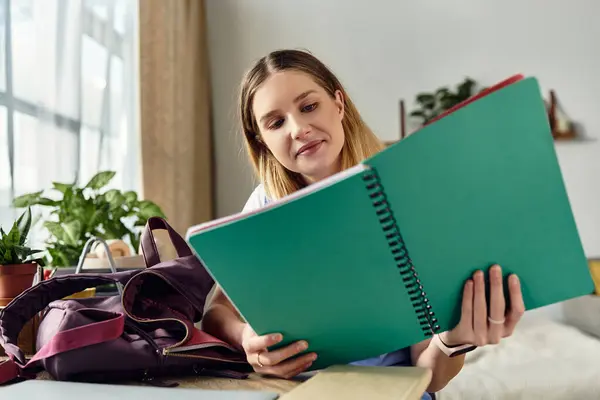A teenage girl enjoys her study time surrounded by plants and a cozy atmosphere in her room. — Stock Photo