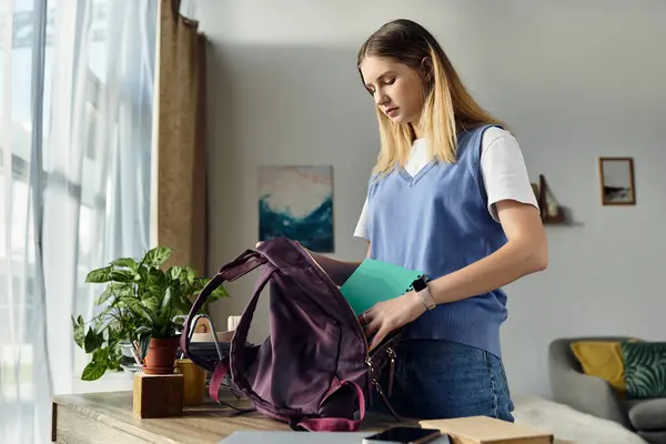 A pretty teenage girl prepares her bag in her cozy room, showcasing youthful lifestyle and energy. — Stock Photo