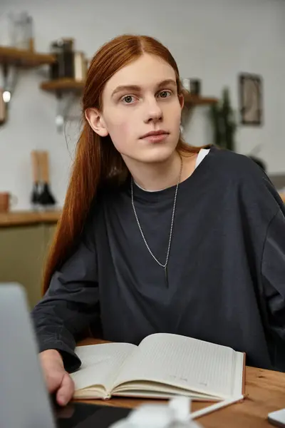 Casual reading unfolds as a young man relaxes in his modern apartment with style. — Stock Photo