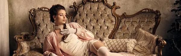 A young woman embodies mystical grace as she lounges elegantly, surrounded by vintage decor. — Stock Photo