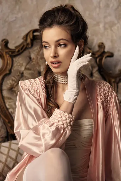 A young woman in vintage attire radiates charm while lost in thought. — Stock Photo