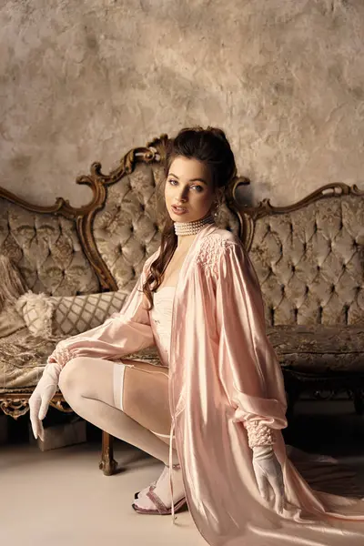 A beautiful young woman dressed in soft vintage attire poses gracefully in a dreamy environment. — Stock Photo