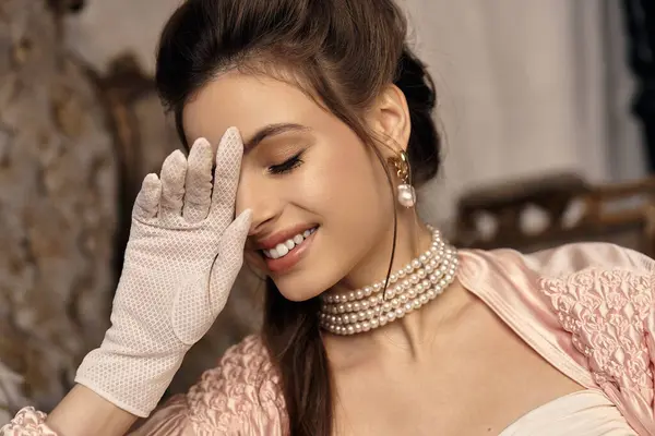 A young woman with a serene smile embodies fantasy with her delicate attire and vintage jewelry. — Stock Photo