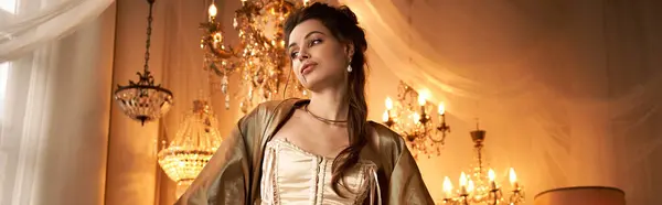 In a lavishly lit room, a young woman portrays a captivating vampire with elegance and charm. — Stock Photo
