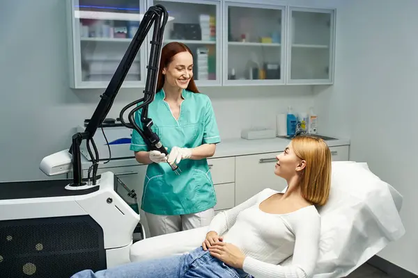 A skilled dermatologist enhances a young womans natural beauty with a specialized procedure. — Stock Photo