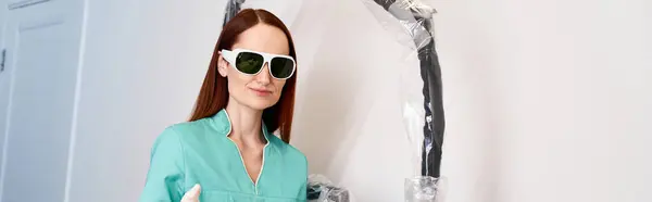 A young woman confidently prepares for a laser hair removal procedure at a sleek clinic. — Stock Photo