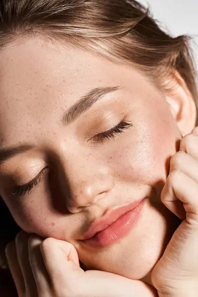 A young beautiful woman closes her eyes, embracing serenity while showcasing her stylish attire. — Stock Photo