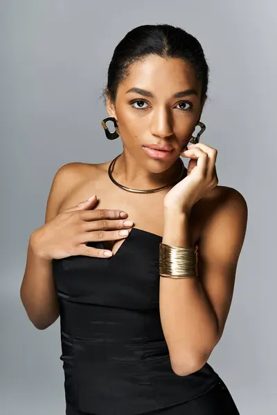 Elegant young woman showcasing chic attire style against a minimalist backdrop. — Stock Photo
