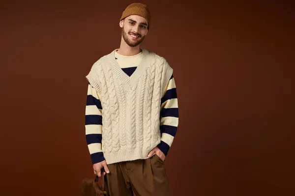 Confident young man showcases his unique fashion sense in a vibrant studio environment. — Stock Photo