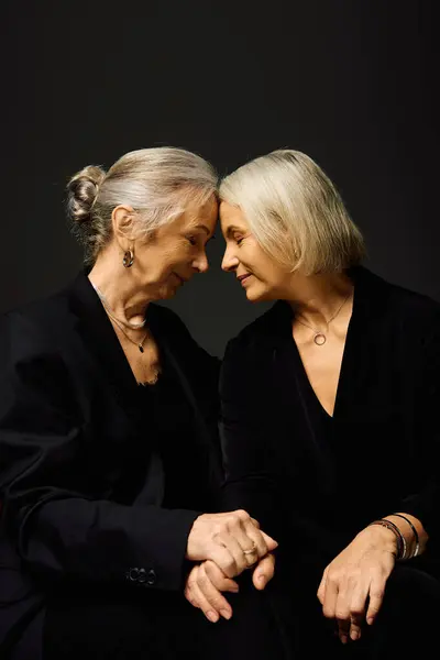 Two women express their love and connection while dressed fashionably, radiating warmth and romance. — Stock Photo