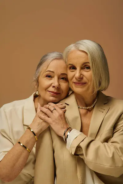 Two sophisticated women share a tender moment, radiating romance and confidence together. — Stock Photo