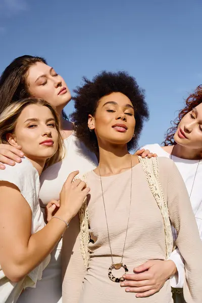 Four stylish women enjoy a sunny day in nature, flaunting their fashion and confidence. — Stock Photo