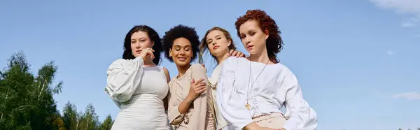 A group of fashionable women exudes confidence and joy while enjoying a sunny day outdoors. — Stock Photo
