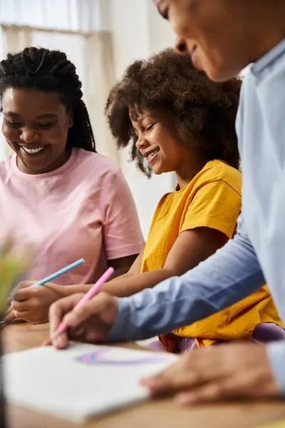 A lovely moment of a diverse family bonding over colorful drawings and joyful laughter together. — Stock Photo