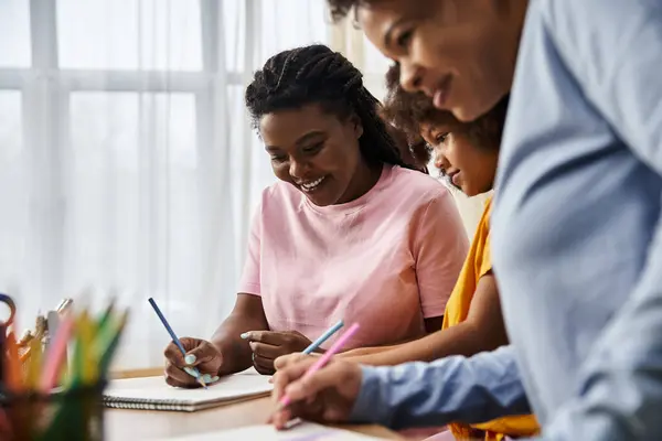 A loving LGBT family shares creativity and laughter while drawing and bonding at home. — Stock Photo