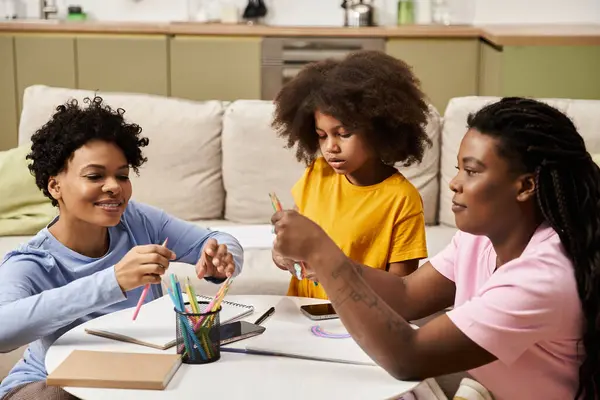 Parents and daughter enjoy crafting together in their cheerful home, sharing moments of joy. — Stock Photo