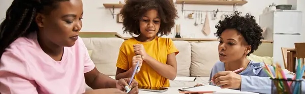 A family shares a warm moment while engaging in creative activities at home, fostering connection. — Stock Photo