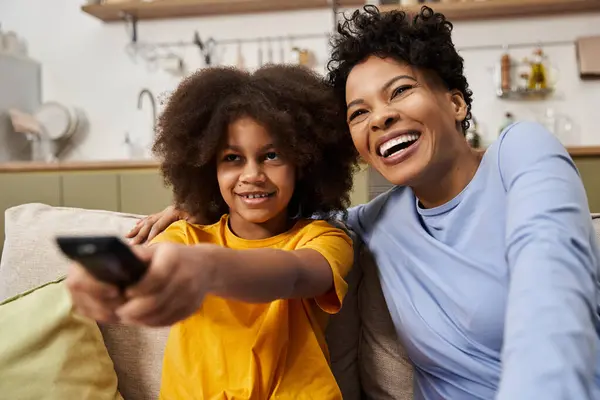 Daughter and parent share joyful moments while enjoying a fun activity together indoors. — Stock Photo