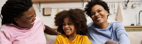 Joyful interactions filled with laughter and warmth among a family at home create lasting memories. — Stock Photo