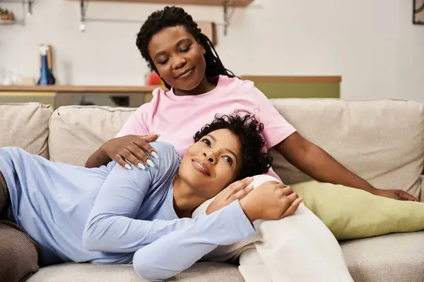 Two woman share a tender moment, enjoying family time filled with warmth. — Stock Photo