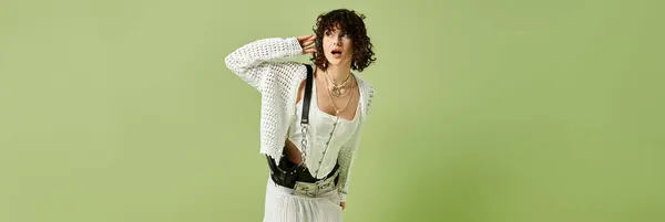 A young and beautiful woman playfully poses in trendy clothes, expressing confidence and style. — Stock Photo