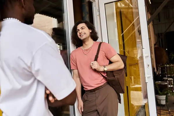 A loving gay couple shares a delightful moment at a charming cafe, surrounded by warmth and smiles. — Stock Photo