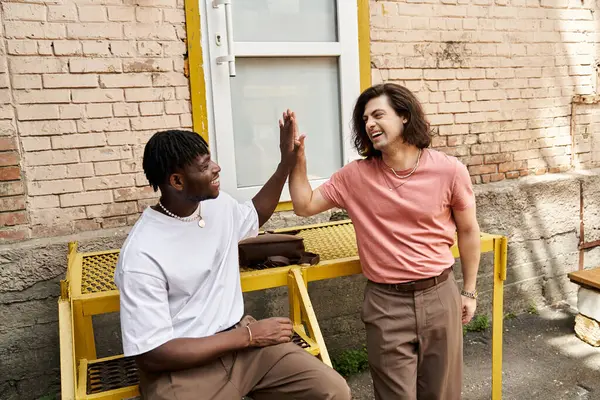 Two handsome men celebrate love and connection at a cozy cafe, bonding over shared moments. — Stock Photo