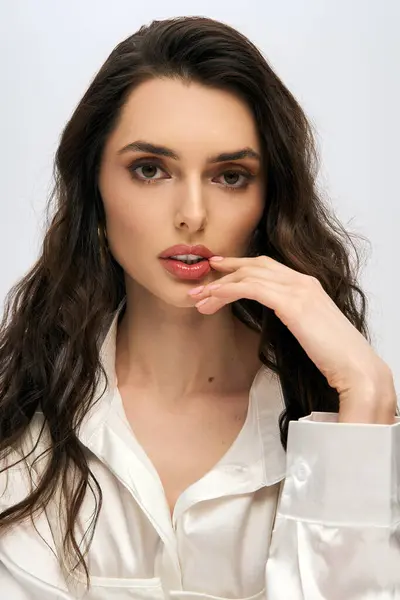 A beautiful young woman with brown hair looking at camera — Stock Photo