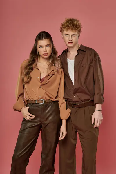Stylish couple showcases their modern outfits while enjoying a moment of connection and love. — Stock Photo