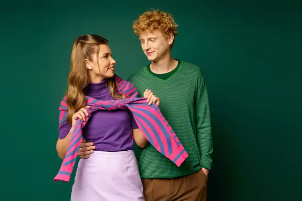 Happy couple shares a glowing moment in stylish outfits, highlighting their love and bond. — Stock Photo
