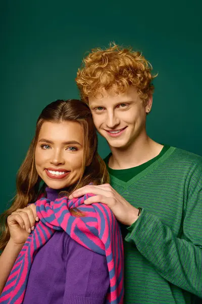 Stylish couple smiles joyfully, showcasing vibrant fashion and a modern romantic vibe. — Stock Photo