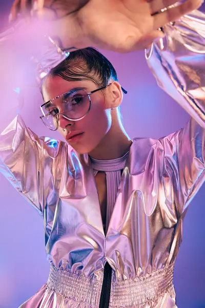 A young, beautiful woman embraces modern fashion with holographic attire in a trendsetting display. — Stock Photo