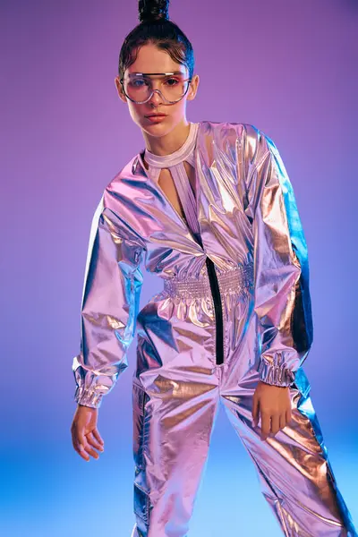 A stylish woman confidently wears futuristic attire with holographic colors under neon lights. — Stock Photo