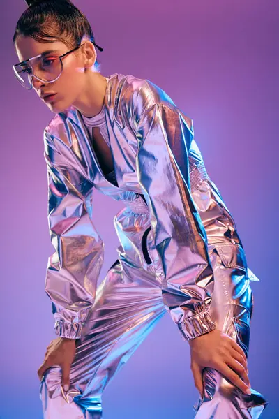 A young woman confidently poses in holographic clothing, showcasing futuristic elegance. — Stock Photo