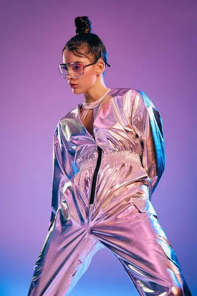 A young woman flaunts a bold futuristic look in shimmering holographic, vibrant attire. — Stock Photo