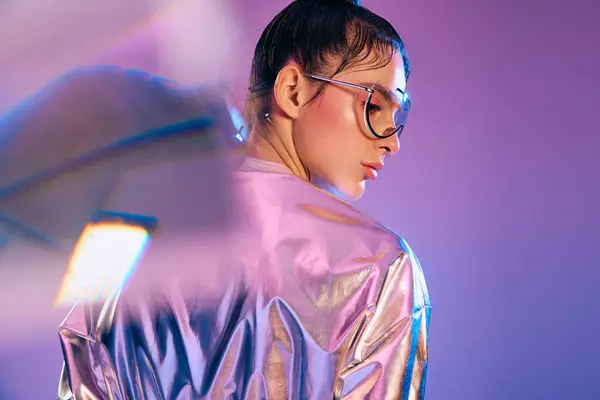 Captivating young woman in metallic attire exudes confidence against a colorful backdrop. — Stock Photo