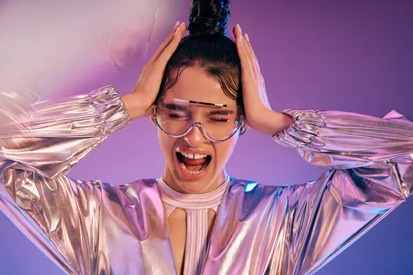 A young woman in holographic attire shows mixed emotions against a vibrant backdrop. — Stock Photo
