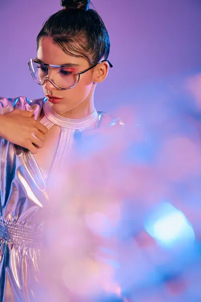 A young woman showcases vibrant holographic fashion, exuding modern elegance and style. — Stock Photo