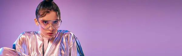 A young woman wears holographic attire, radiating beauty and confidence in a vibrant setting. — Stock Photo