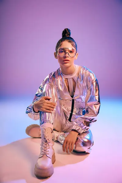 A graceful young woman models her stylish holographic outfit and trendy look. — Stock Photo