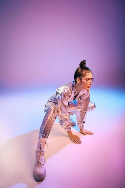 A young woman elegantly poses in an experimental holographic outfit, exuding modern fashion vibes. — Stock Photo