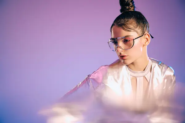 A young woman showcases striking holographic attire, exuding modern elegance and creativity. — Stock Photo