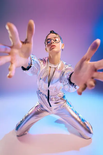 A young woman in vibrant holographic attire confidently showcases her expressive stance. — Stock Photo
